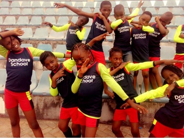 Pupils in Dandave School sports kits at the stadium
